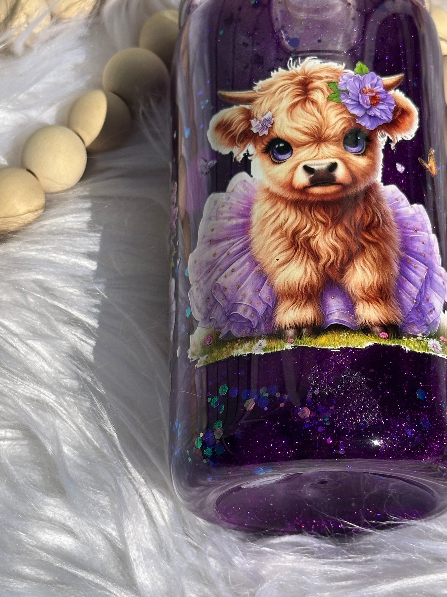 Purple glitter snow globe